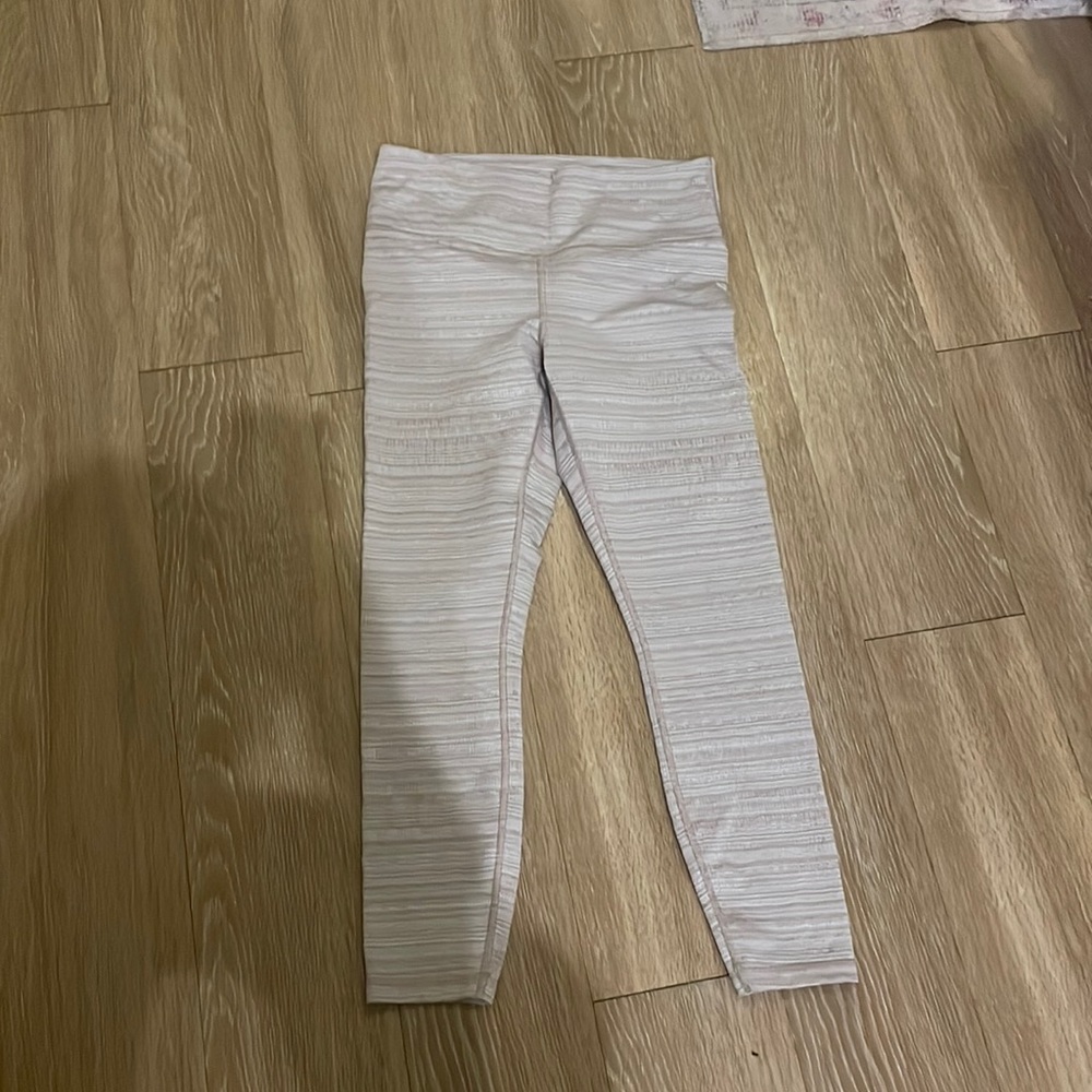 Athleta neutral patterned leggings in size medium